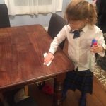 Elsie cleaning the table