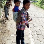 brothers carrying each other